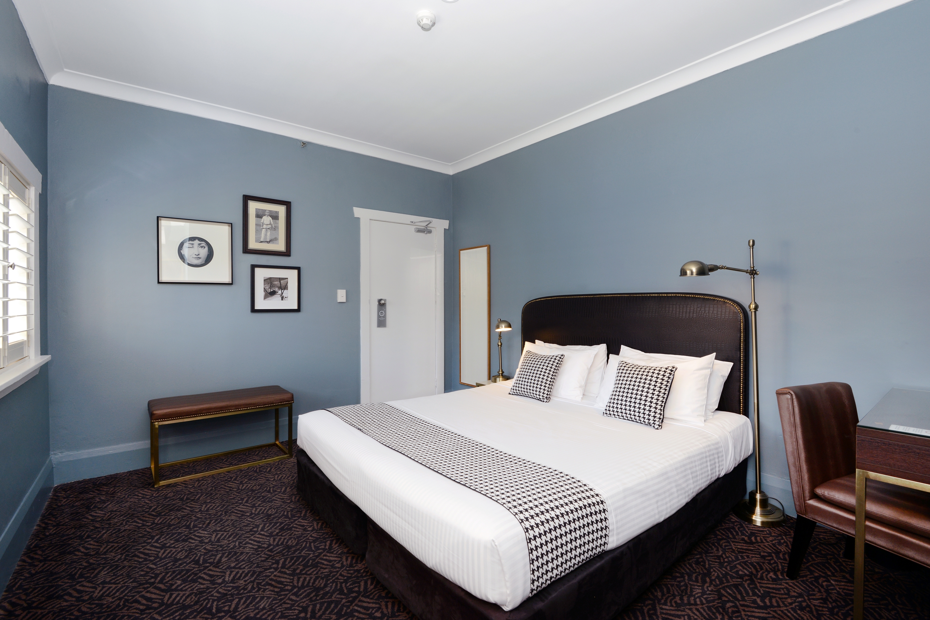 King bed in vintage-style room at The Maisonette