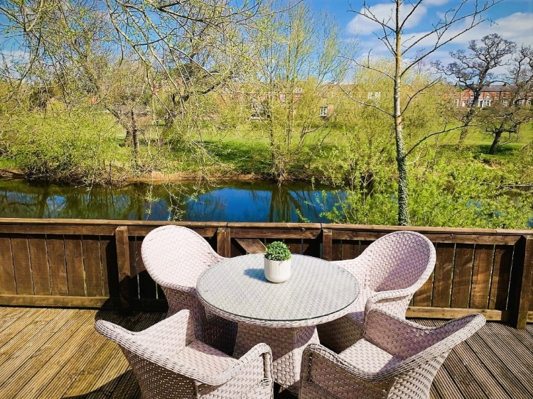Alfresco dining overlooking the River Ure at Riverside Lodges in Ripon