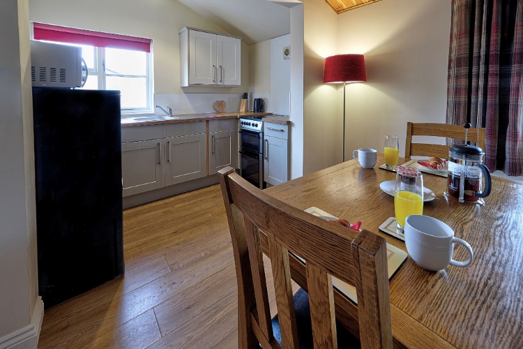 Kitchen and Dining Area, Minster Lodge at Riverside Lodges in Ripon