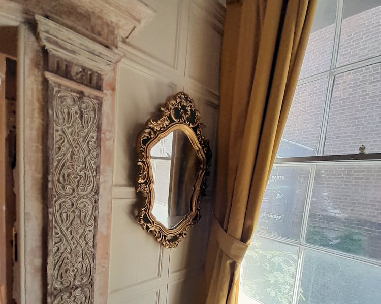 Antique mirror in the Judge Huddlestone bedroom