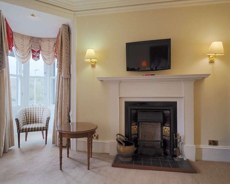 Deluxe harbour view room with fireplace and seating area in the Royal Hotel, Stornoway on the Isle of Lewis