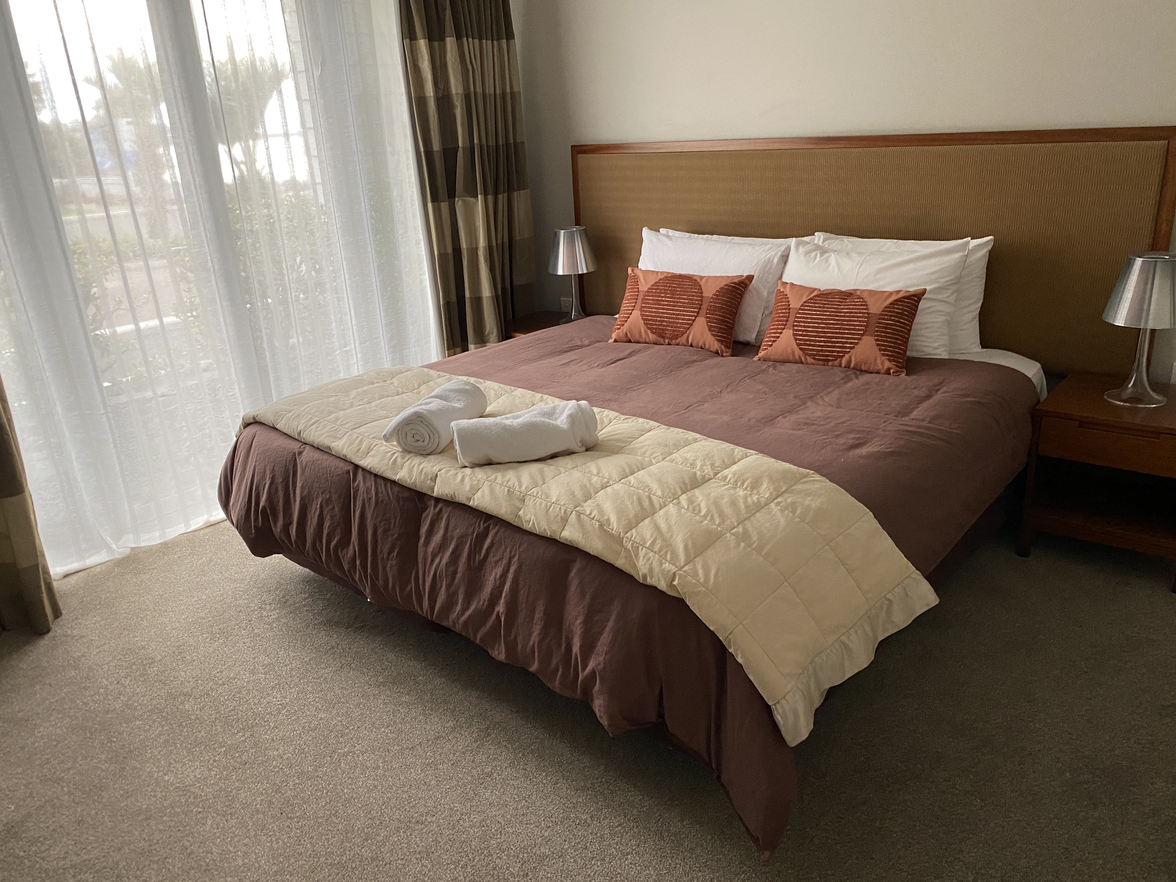 Bedroom includes the spoils of "HILTON" Brand Pillows and Duvet.