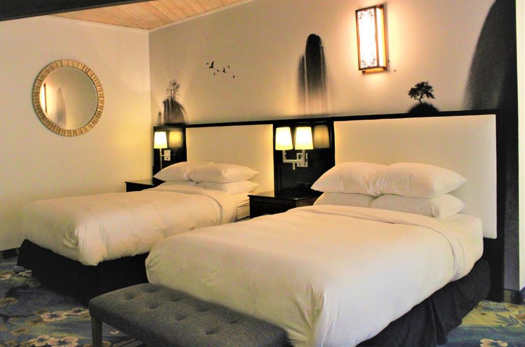 Family room at WangShi Palace with two XL beds and spacious layout, Oklahoma City