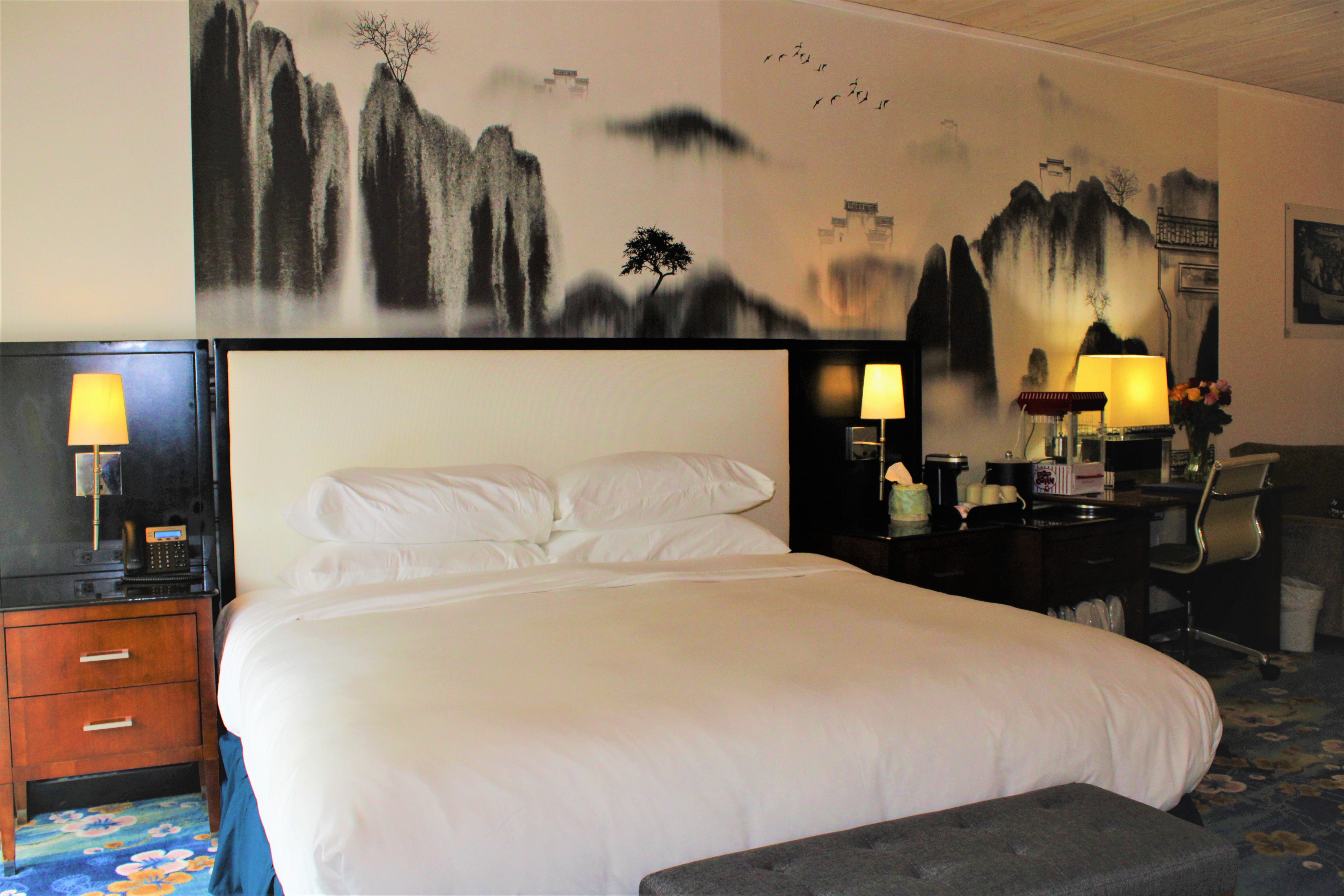 Family-friendly room at WangShi Palace with seating area and warm lighting, Oklahoma City