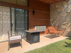 Ground-level patio with fire pit and outdoor seating