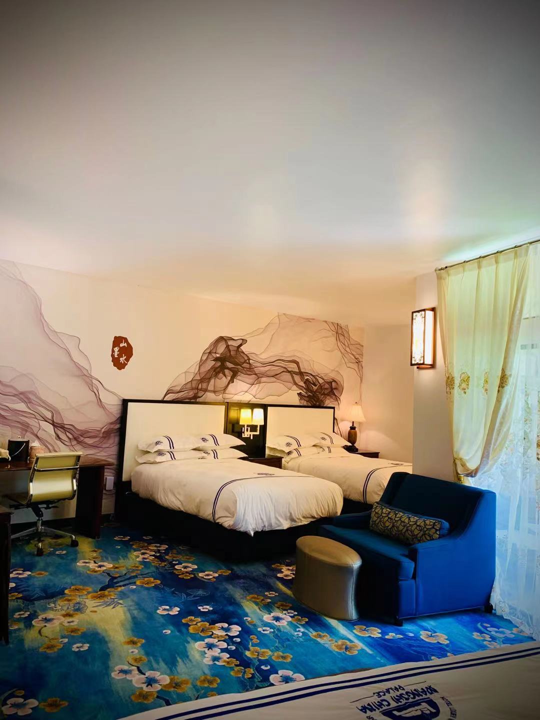 Family room with one king bed and two XL beds, featuring a wheelchair-accessible shower, spacious layout, and ideal accommoda