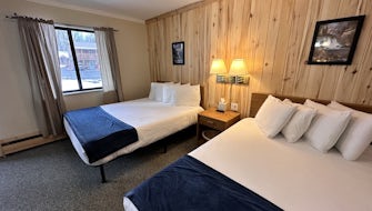 1 King Bed + 1 Full Bed Lodge Room