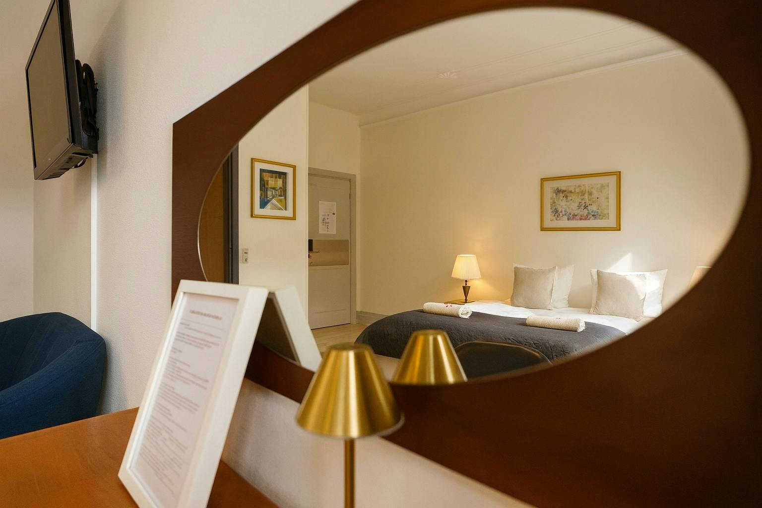 Mirror view of Hotel Amager Copenhagen junior suite showcasing spacious luxury accommodation