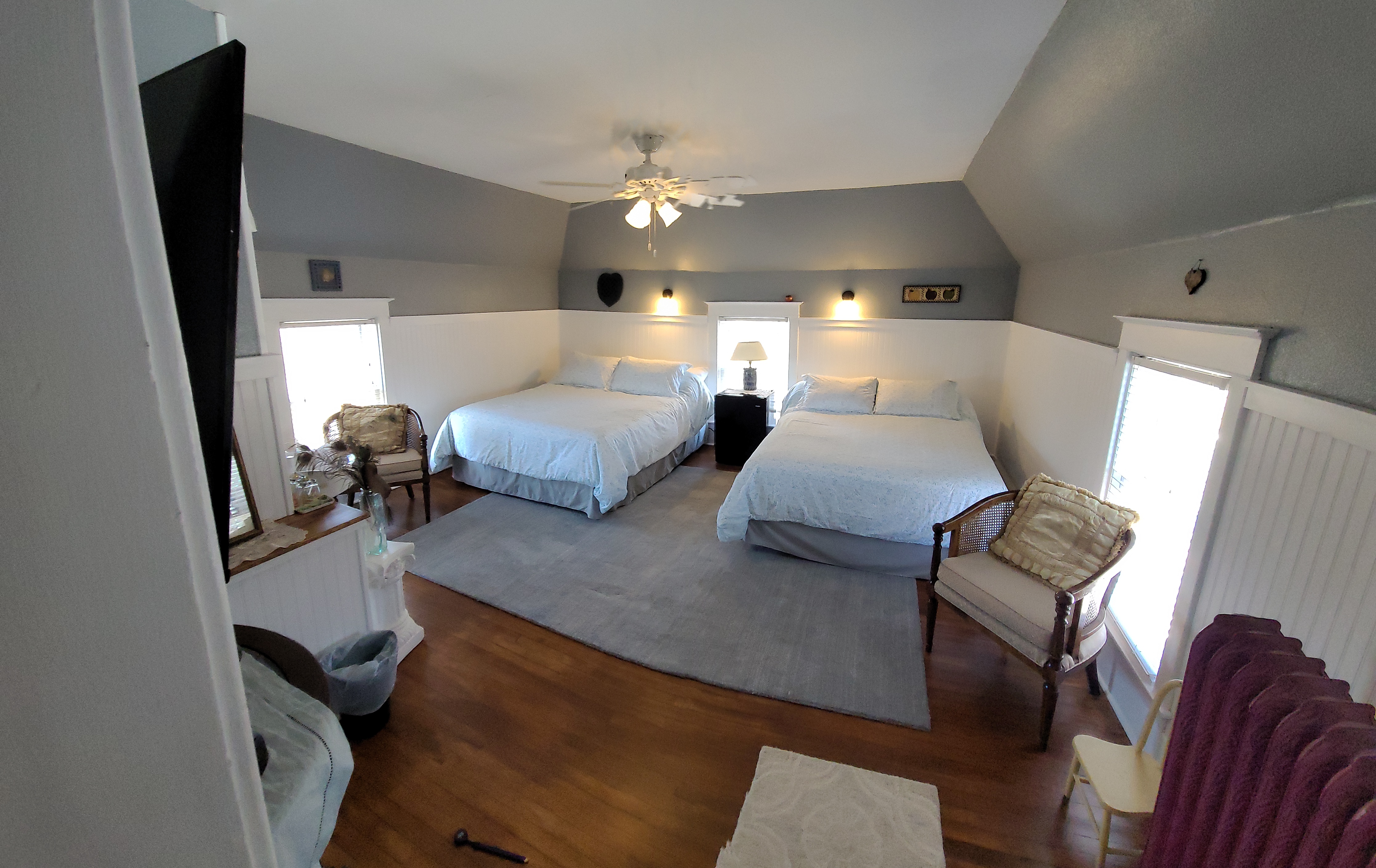 two queen beds in a small room